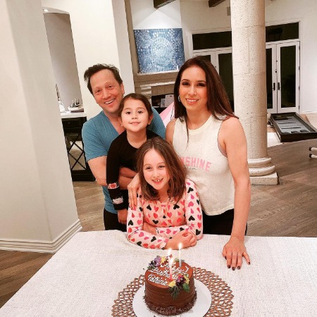 Miranda Scarlett Schneider celebrating her mother's birthday with her father and younger sister. 